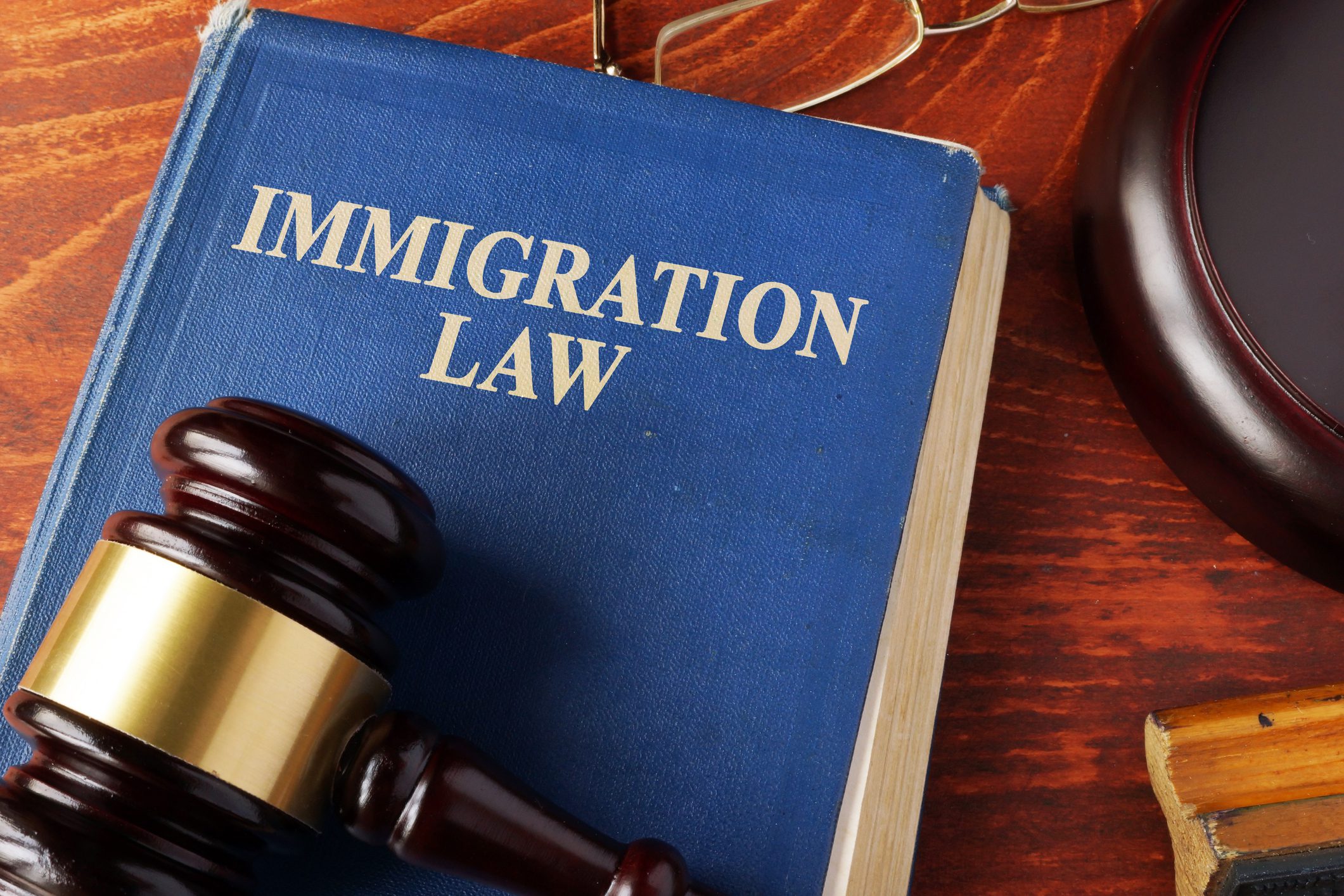 Book with title immigration law on a table. Book with title immigration law on a table.
